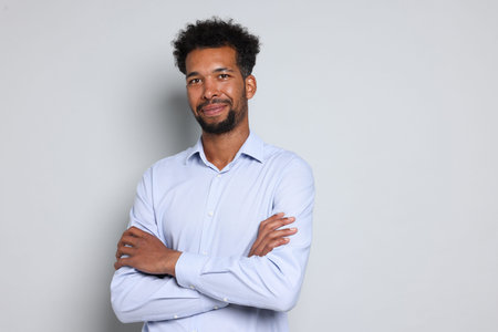 Portrait of handsome man on white background, space for text