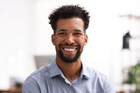 Portrait of handsome man in shirt at workplaceの写真素材