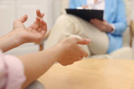 Professional psychologist working with patient in office, closeupの写真素材