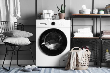 Laundry room with modern washing machine. Interior designの写真素材