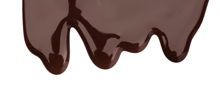 Flowing tasty melted chocolate on white backgroundの写真素材