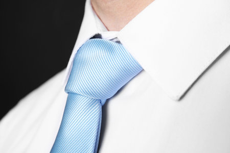 Man in suit with stylish necktie on black background, closeupの写真素材