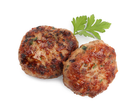 Delicious meat patties with parsley isolated on white, above viewの写真素材