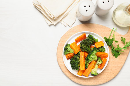 Tasty grilled vegetables served on white wooden table, flat lay. Space for textの写真素材