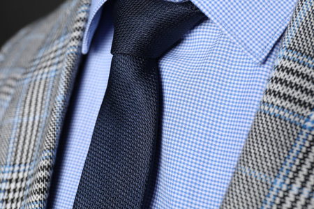 Man in suit with stylish necktie, closeup