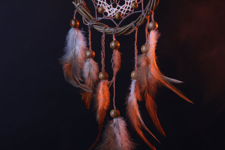 Beautiful dream catcher against black background, closeup