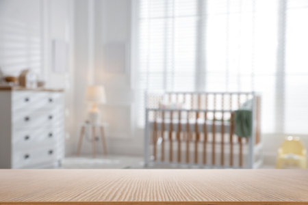 Empty wooden table in baby room. Space for designの写真素材