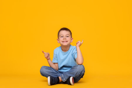 Cute little boy sittingの写真素材