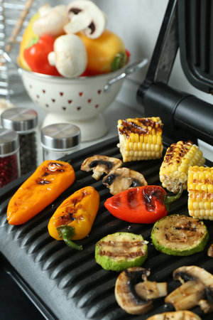 Electric grill with delicious vegetables on table, closeupの写真素材