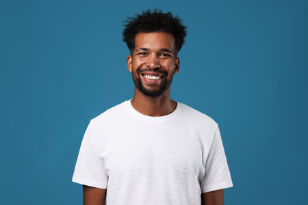 Portrait of man on light blue backgroundの写真素材