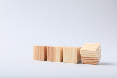 Blank wooden cubes on light background, closeup. Space for textの写真素材