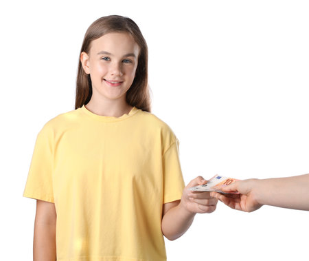 Mother giving her daughter pocket money on white background, closeupの写真素材