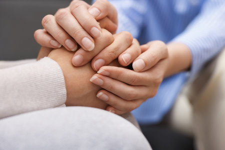 Professional psychologist supporting patient during therapy in office, closeupの写真素材
