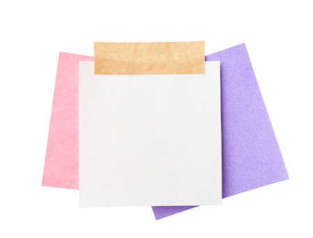 Blank paper notes with adhesive tape isolated on whiteの写真素材