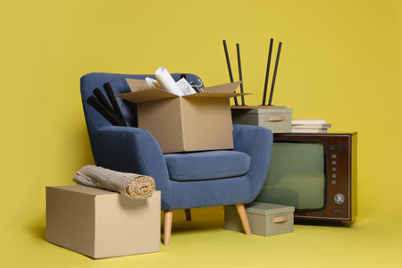 Garage sale. Different used stuff on yellow backgroundの写真素材