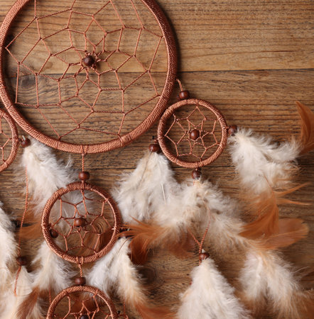 Beautiful dream catcher on wooden background, top viewの写真素材