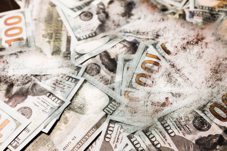 Money laundering. Many dollar banknotes and foam as background, closeupの写真素材