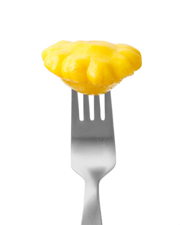 Fork with pickled pattypan squash isolated on white