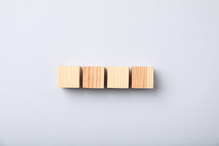 Wooden cubes on light background, top viewの写真素材