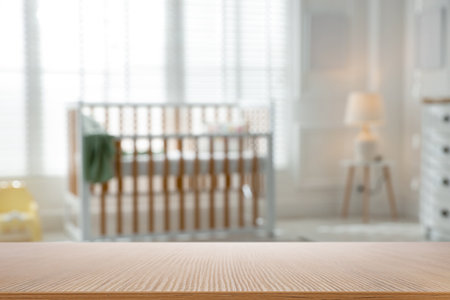 Empty wooden table in baby room. Space for designの写真素材