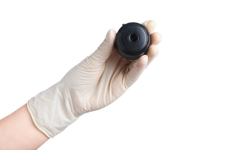 Woman with hidden spy camera on white background, closeupの写真素材