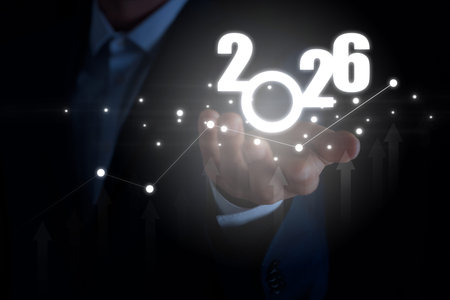 Businessman holding virtual numbers in hand against black background, closeupの写真素材