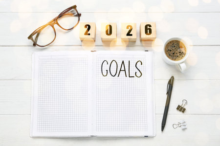 New Year. 2026 made of cubes and notebook with word Goals on wooden table, top viewの写真素材