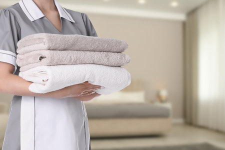 Clean towels in hotel room, closeupの写真素材