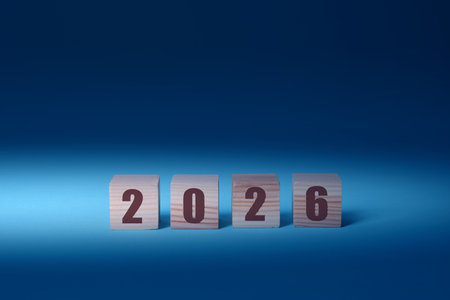 New 2026 Year. Wooden cubes with numbers on blue backgroundの写真素材