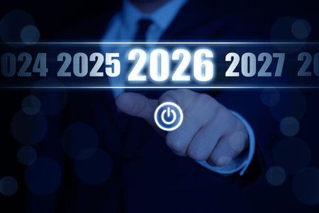 Businessman choosing 2026 year among others from 2024 to 2027 on virtual screen with power symbol...
