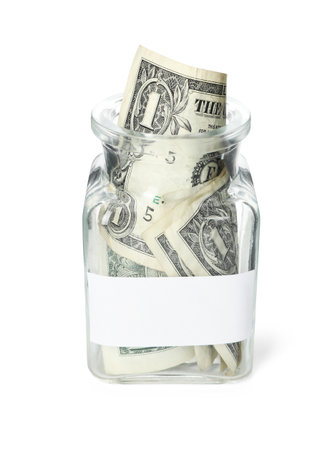 Jar with blank note and dollar banknotes isolated on white. Money savingsの写真素材