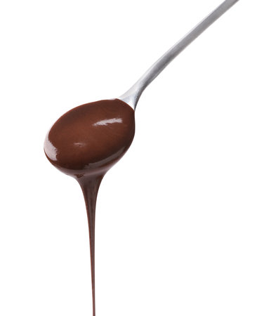 Tasty melted chocolate flowing down from spoon on white backgroundの写真素材