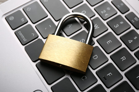 Password concept. Closed padlock on laptop, above view