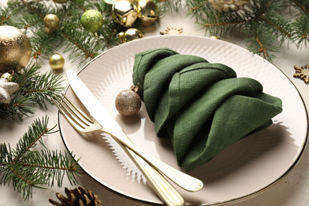 Festive table setting with Christmas decor on beige background, closeupの写真素材