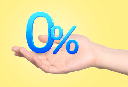 Woman holding 0 percent sign against yellow background, closeup. Zero commissionの写真素材