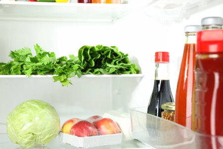 Bottles with different tasty sauces in refrigerator, closeupの写真素材