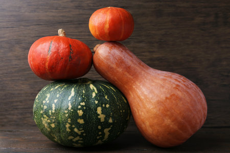 Many fresh pumpkins on wooden table, closeup. Gourd familyの写真素材