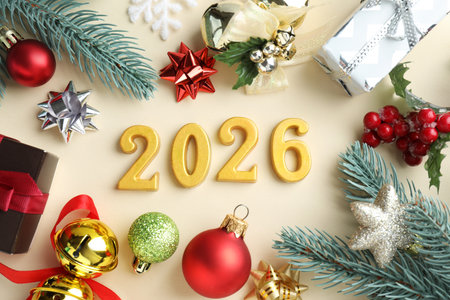 New 2026 Year. Golden numbers and festive decor on beige background, flat layの写真素材