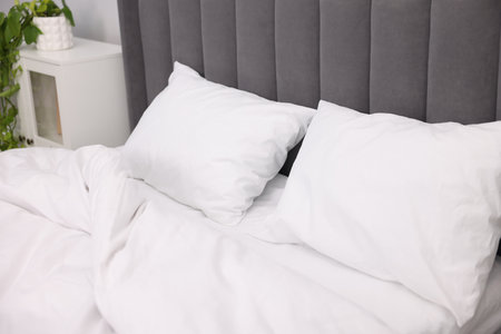 Bed with cozy fresh lines indoors, closeupの写真素材