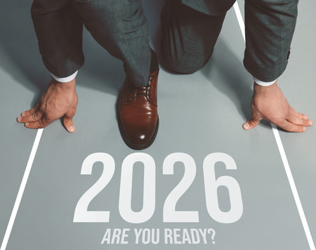 New 2026 Year. Businessman in starting position in front of phrase Are You ready? and numbers on...