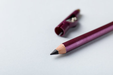 Eye pencil with sharpener on light background, closeup. Space for textの写真素材