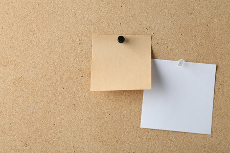 Blank colorful notes pinned on cork board, space for textの写真素材