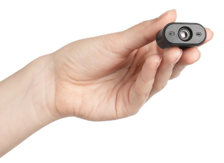 Woman with hidden spy camera on white background, closeupの写真素材