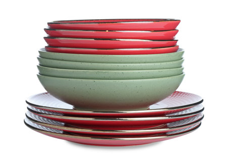 Stack of different ceramic dishware isolated on whiteの写真素材