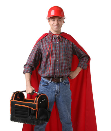 Builder with toolbox wearing hardhat and superhero cape on white backgroundの写真素材