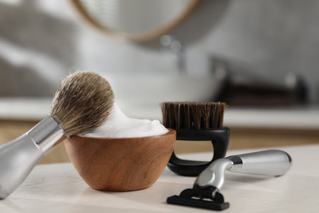 Barber's tools on white wooden table indoors, closeupの写真素材