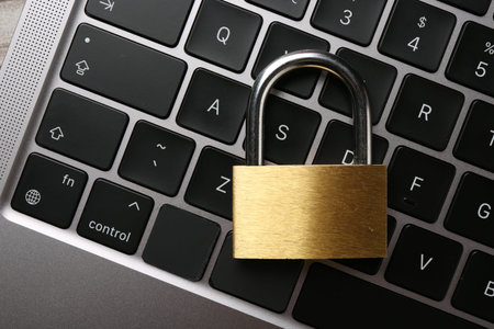 Password concept. Closed padlock on laptop, top view