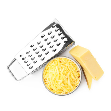 Grated and pieces of cheese with grater isolated on white, top viewの写真素材