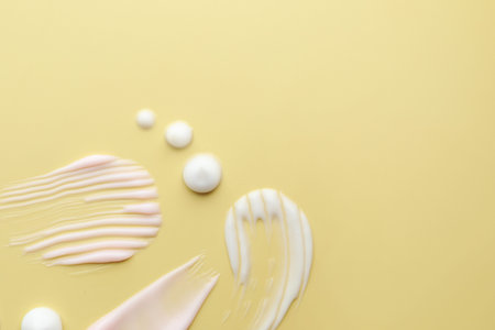 Samples of cosmetic product on beige background, flat lay. Space for text