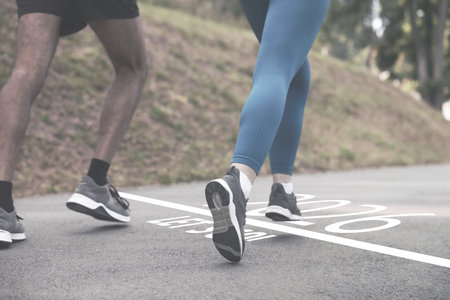 New 2026 Year. Couple running on road with numbers and phrase Let's Go!の写真素材